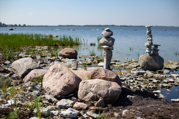 Fototapeta na wymiar Stone figures on the beach of the Sorve Peninsula in the Ojessaare Nature Reserve. Estonia