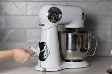 Stand mixer with a cord organizer