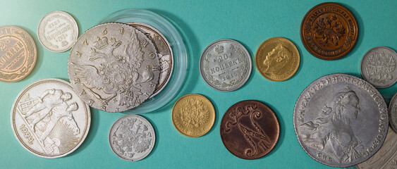 Numismatics. Old collectible coins on the table. Top view. Banner. - 566921124