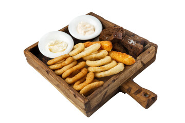 Breaded onion and squid rings, crispy croutons and fried cheese with sauce served on a wooden board. Appetizing popular snack for beer. Close-up. Isolated on white background.