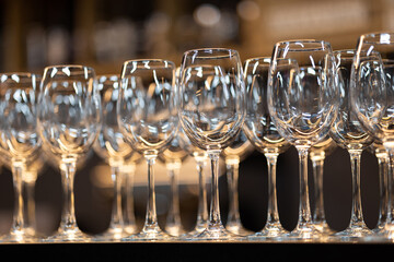 Empty wine glasses on the background of the bar. The beginning of the wine tasting