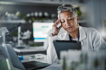 Headache, tired and scientist woman in laboratory working on tablet for pharmaceutical research or...