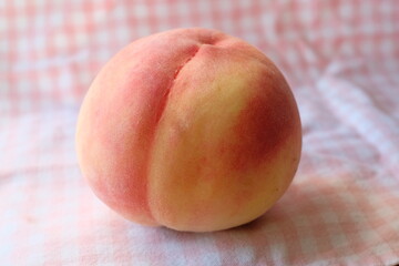 ripe peach on a table