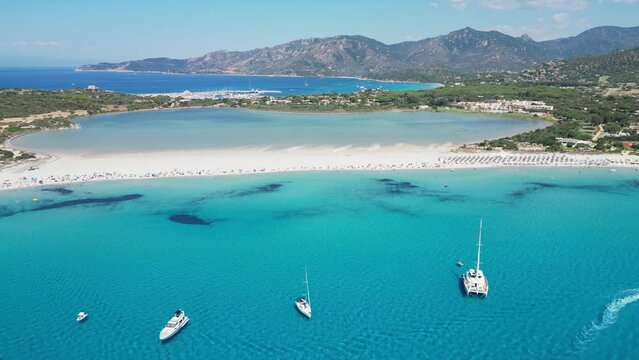 Porto Giunco Beach in Villasimius, Sardinia, Italy - Turquoise Blue Mediterranean Sea and Salt Lake - Aerial 4k