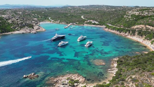 La Maddalena Island, Caprera, Sardinia - Boats and Yachts in Turquoise Blue Bay - Aerial 4k