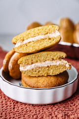 dessert cookies whoopie with cream carrot pumpkin butter cream delicious on orange background
