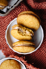 dessert cookies whoopie with cream carrot pumpkin butter cream delicious on orange background