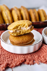 dessert cookies whoopie with cream carrot pumpkin butter cream delicious on orange background