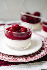 dessert with strawberries fresh mousse pannacotta berry jelly monochrome photo red and white photo sweets on english porcelain retro tableware