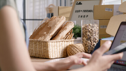 Go green SME owner reply chat comment online talk or set up chatbot on phone. Young seller asia...