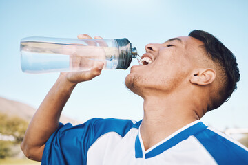 Water, bottle and football or soccer player on sports field resting after match or competition on a...