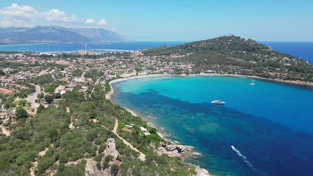 Arbatax Port Town and Cove with Turquoise Blue Sea in Sardinia, Italy - Aerial 4k