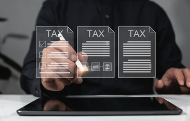 concept of the concept of the tax payer Examination of documents related to tax payment Businessman filling out and calculating tax payment online documents for annual tax payment.