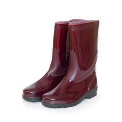 Red rubber boots with black soles isolated on a white background.