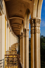 Old colonnade with balcony in an abandoned palace