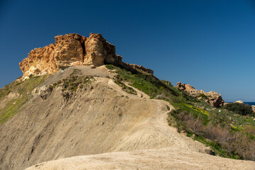 Fototapeta na wymiar View to stone hill in Malta at coast, Gozo