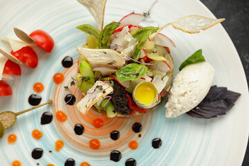Salmon tartar with quail egg and bread chips