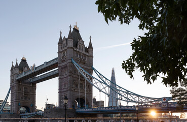 Naklejka premium Tower Bridge in UK with sunset in beautiful day. Capital city in Great Britain with famous building architecture. Tourism and attraction in Europe.