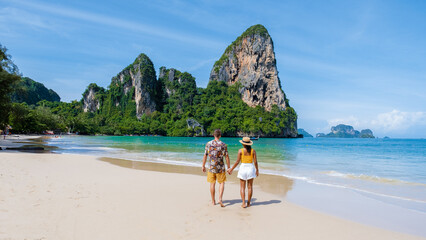 Railay Beach Krabi Thailand, a couple of men and woman on the beach in Thailand