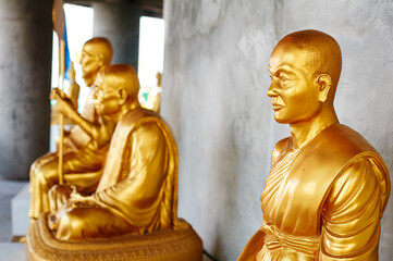 Golden statues of buddhist monks.