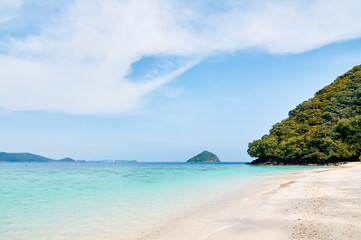 Fototapeta na wymiar Beautiful tropical landscape. Sandy beach with blue clear water.