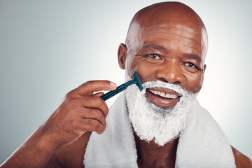 Black man, face and cream to shave with razor, portrait for beauty and grooming isolated on studio...