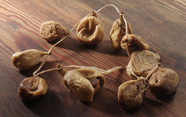 Naturally sweet dried figs in the sun. Dried figs on the wooden table
