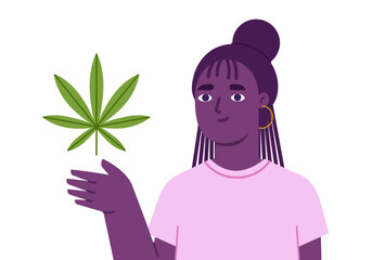 Black female presenting cannabis leaf on hand - 566958938