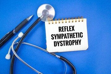 stethoscope, pen and notebook with the words reflex sympathetic dystrophy