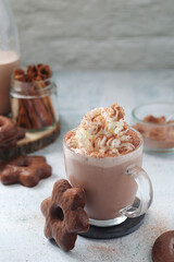 A glass mug with hot chocolate	
