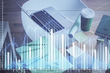 Financial market graph hologram and personal computer on background. Multi exposure. Concept of forex.