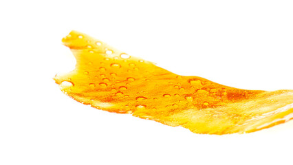 golden cannabis dab isolated on white background