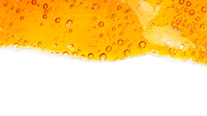 cannabis golden wax resin and white background with place for text