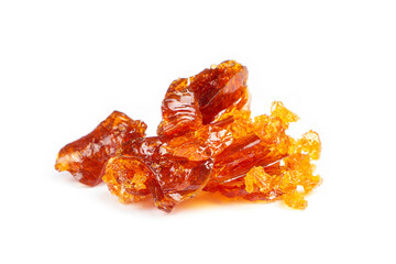 amber pieces of cannabis wax clsoeup. concentrate dab with high thc