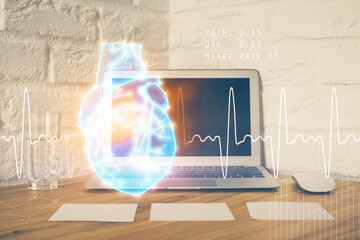 Desktop computer background and heart drawing. Double exposure. Medical study and healthcare concept.