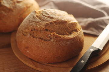 A loaf of rye bread in low key