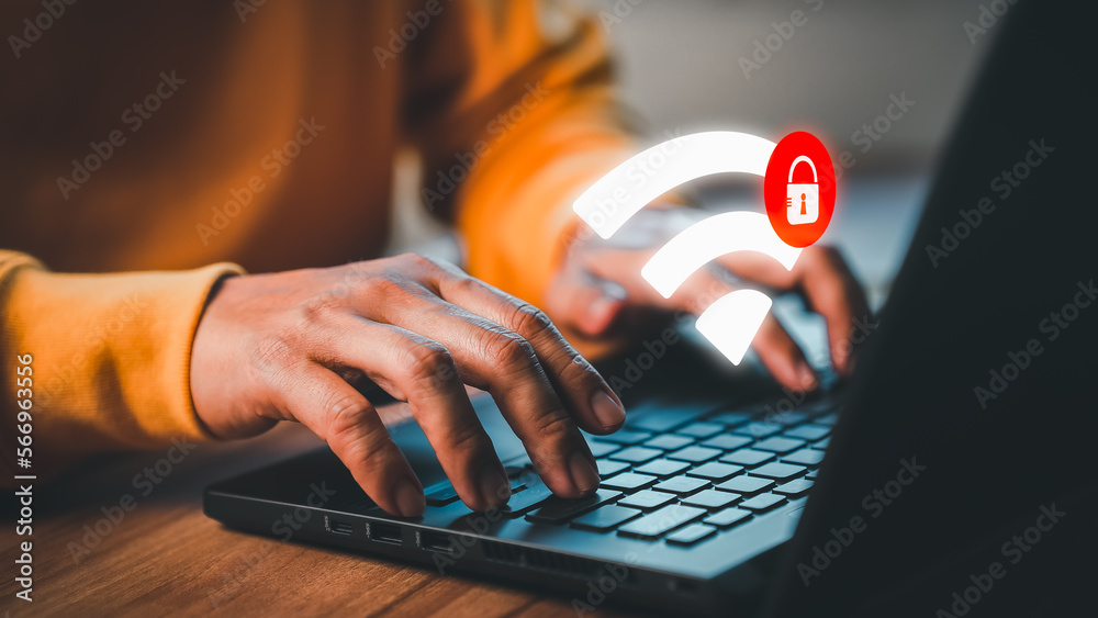 Aufkleber Man using laptop computer in office connected to internet wifi and wait for the digital business data format website to load but wifi not connecting. Concept technology of waiting to connect to Wi-Fi.