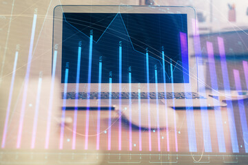Financial market graph hologram and personal computer on background. Multi exposure. Concept of forex.