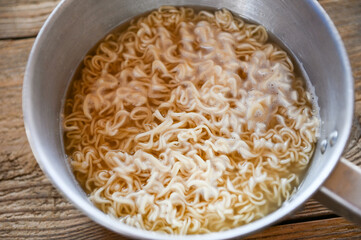 boiled instant noodles on hot pot - instant noodle cooked food - 566964100