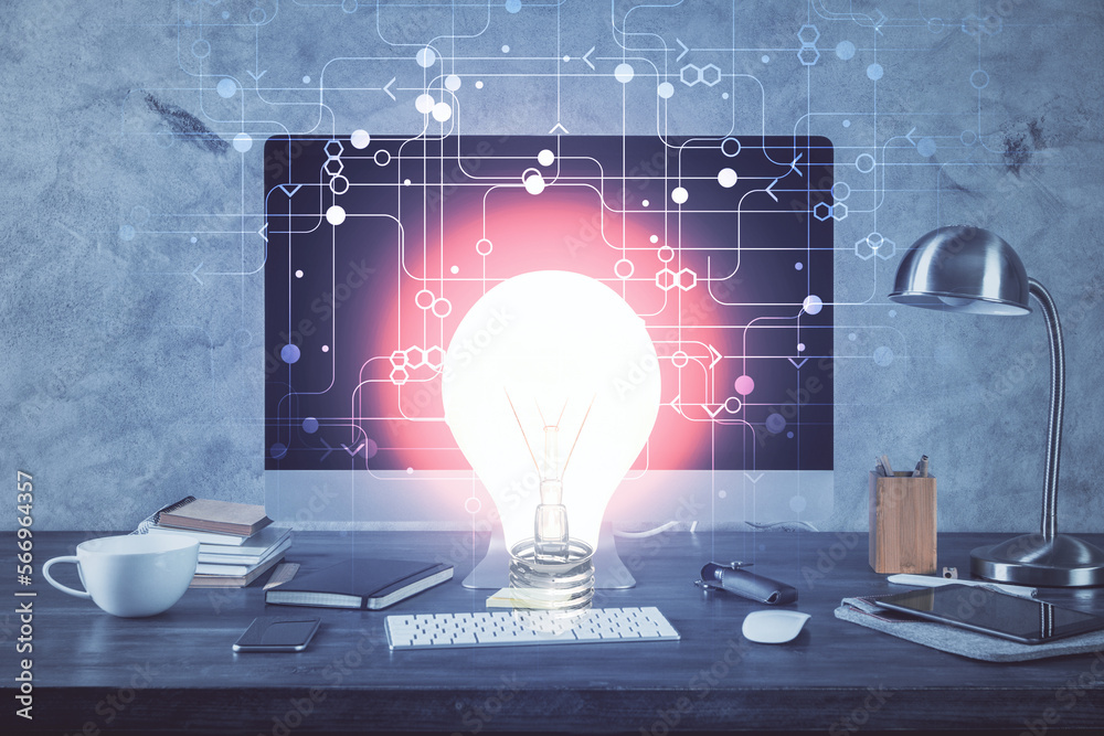 Poster computer on desktop in office with bulb icon hologram. multi exposure. concept of idea.