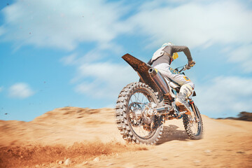 Back of motorbike, offroad sports and speed on blue sky, desert sand or trail. Driver, cycling and power on dirt track, hill and motorcycle performance competition on adventure course for fast action