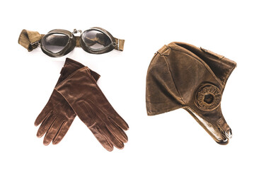 Retro aviator pilot equipment - helmet, goggles and gloves on a white background. High quality photo