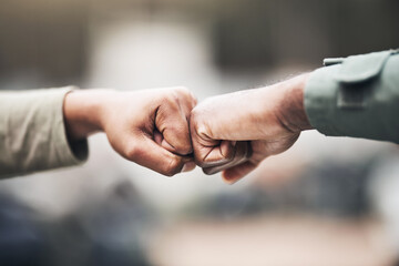 People, hands and fist bump for agreement, deal or trust in partnership, unity or support on a...