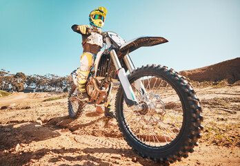 Motorcross, motorcyclist and man in sports gear for challenge, offroad race and desert rally....