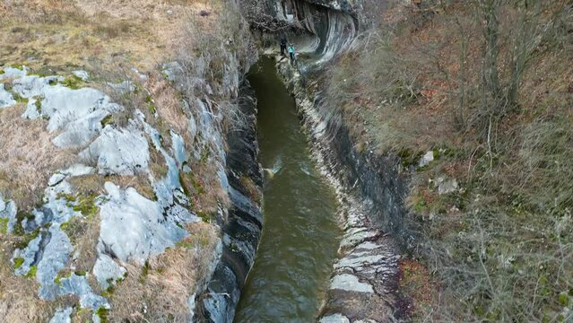 Drone flight over spectacular Banitei gorge, geological formation near Petrosani town, Romania, Europe.