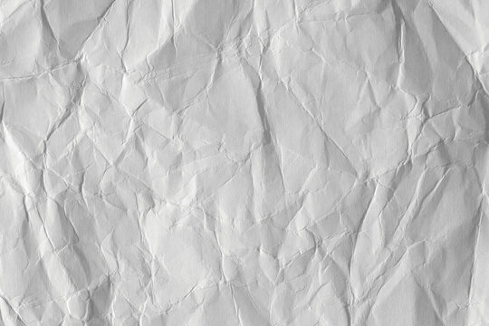 White crumpled paper background, texture old for web design screensavers. Template for various purposes or creating packaging.