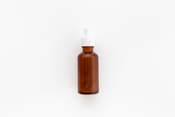 Cosmetic products concept - face serum essential oil in dropper bottle
