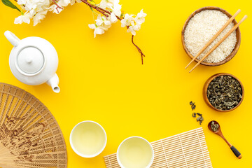 Asian concept with tea set and rice bowl, top view