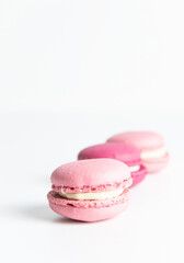 Pink macaroons on white background