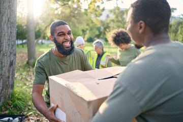 Community service, black man and giving box in park of donation, volunteering or social responsibility. Happy guy, NGO workers and helping with package outdoor of charity, support or society outreach - obrazy, fototapety, plakaty